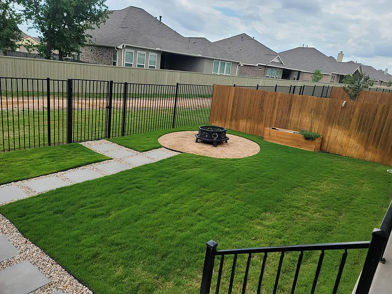 Fully Landscaped backyard with firepit seating area (firepit included)