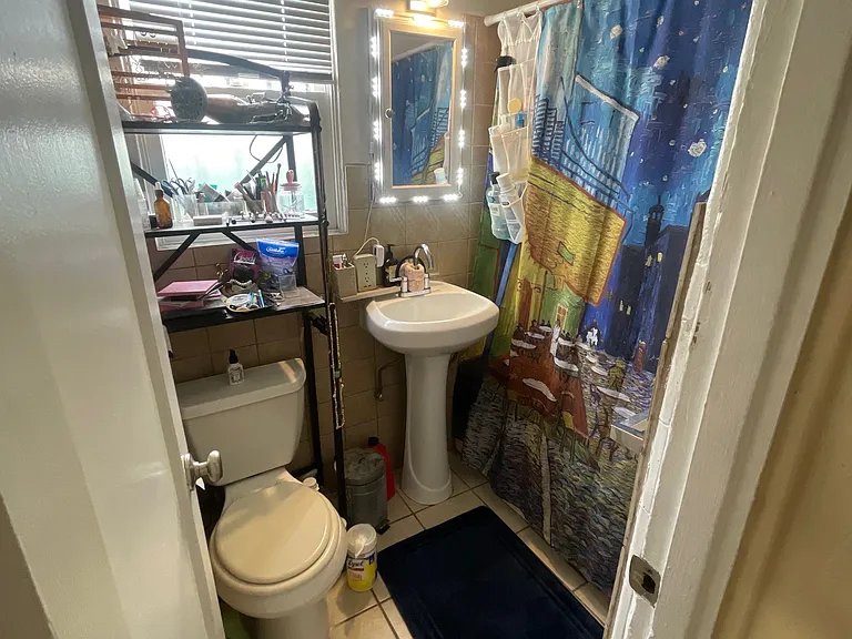 Full sized bathroom with bathtub