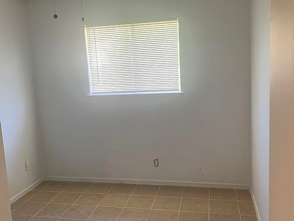 New flooring, ceiling fan, blinds in 1st bedroom