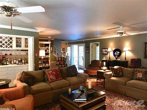 Gracious living room; FP/private bar/hardwoods