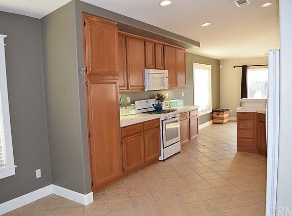 Kitchen with nearly new microwave, stove and oven.