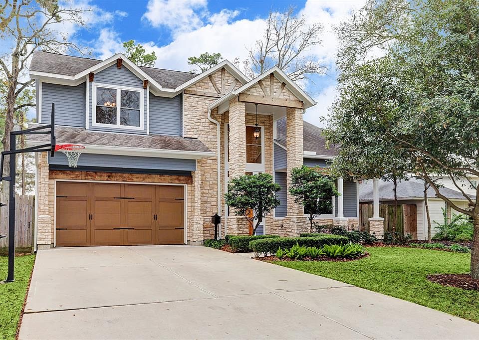 Wonderful custom built home in Oak Forest with great curb appeal! Lovely trees and a front porch welcome you home. Note the stone and beam accents on this great home! Double wide driveway affords extra parking as well as a play area.