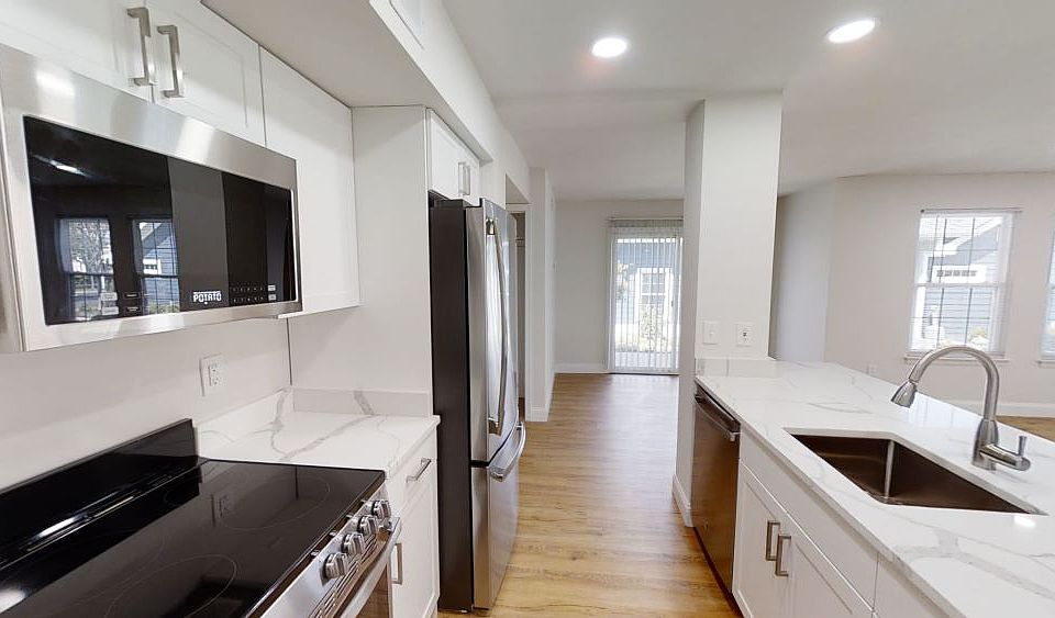 Our Premier Style Homes Feature Designer Quartz Countertops & White Cabinets