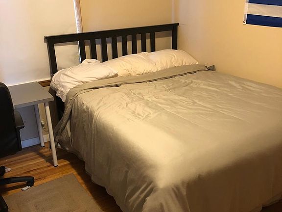 3rd bedroom, currently with a queen sized bed and a large cl