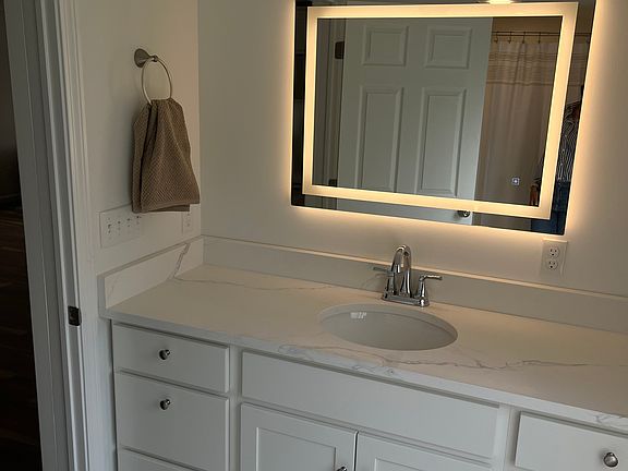 Backlit mirror in bathroom