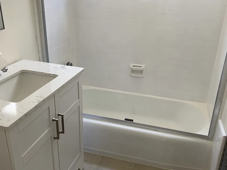 shower with bath, vanity.