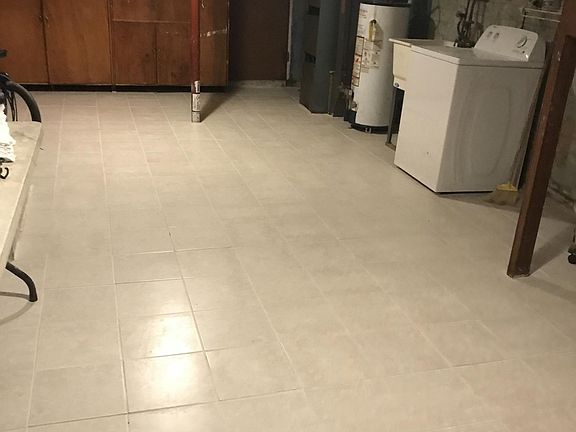 Basement w/ ceramic floor Washer and Dryer