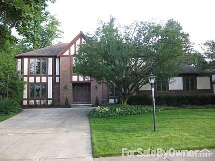 Front View
						:
						Gold Maple on the left and two flowering crabs in front of the garage