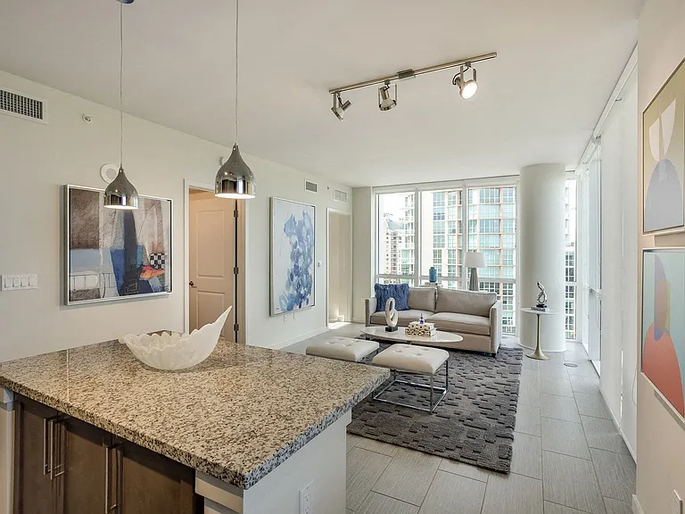 Let the outdoors in with our floor to ceiling windows, equipped with roller shades