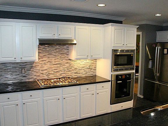 Gourmet kitchen featuring granite counter tops, custom glass backsplash,top of the line Bosch stainl
