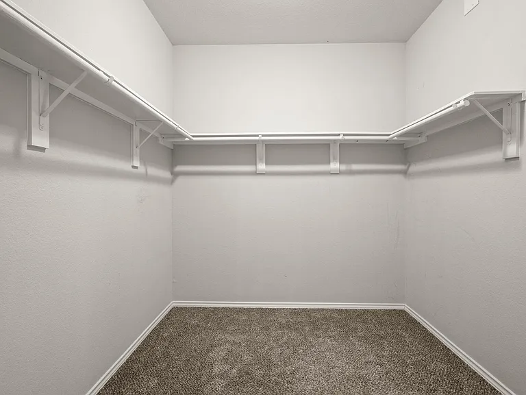 YOUR LARGE WALK-IN CLOSET, CONNECTED TO BOTH THE MASTER BATH AND THE LAUNDRY ROOM!