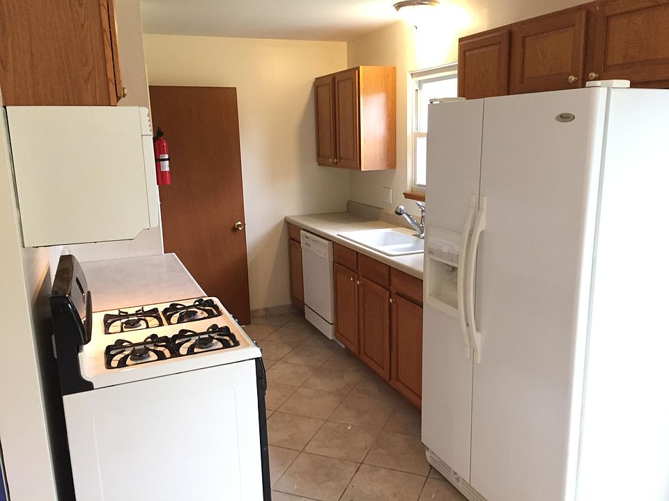 Kitchen looks to backyard