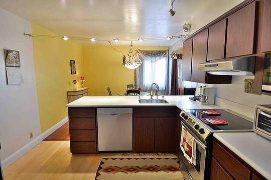 Kitchen with refrigerator, dishwasher, stove top and oven. Supply your own microwave.