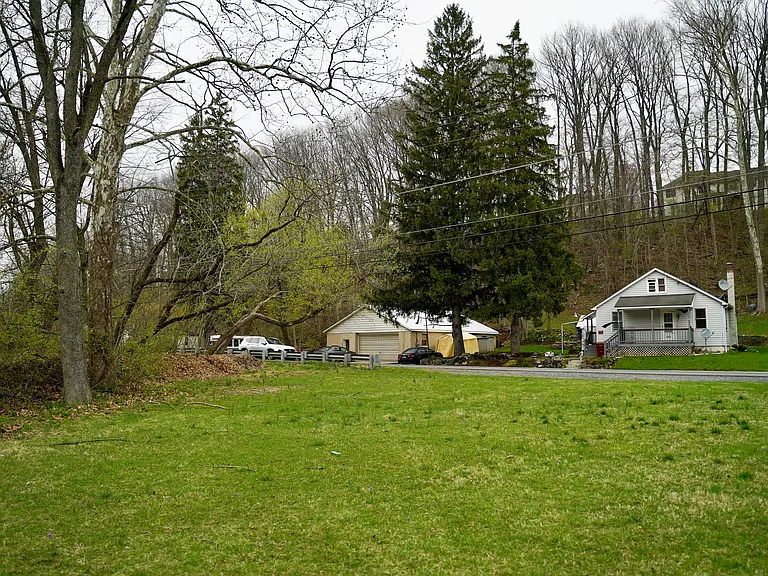 2 bed/1bath house with porch basement & attic. Comes with side yard and useable space across the street