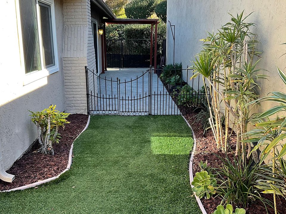 Easy Care Turf Grass and lovely patio area off Kitchen / Dining