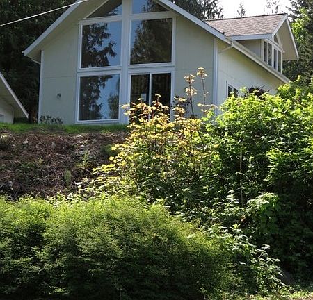 Chalet style w/ lg windows facing view