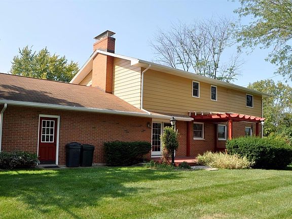 A view of the rear exterior showing the partially coverd deck.
