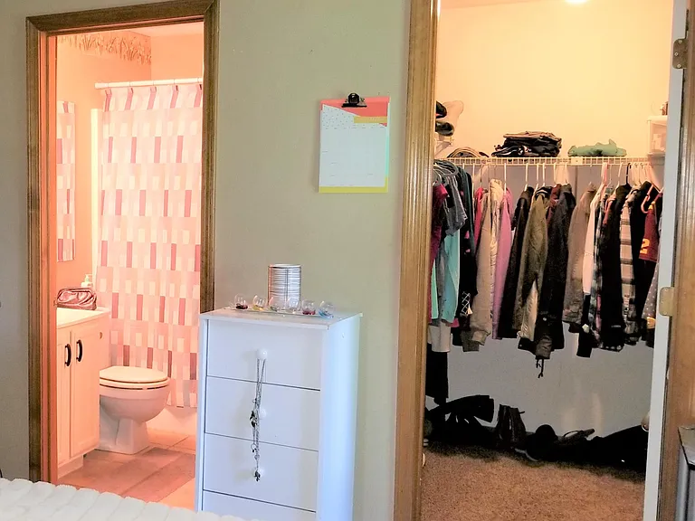 Large walk-in closet and bathroom from bedroom