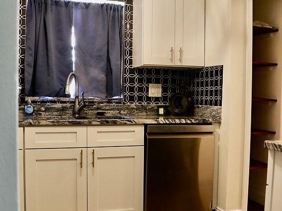 White cabinets with beautify tile backsplash