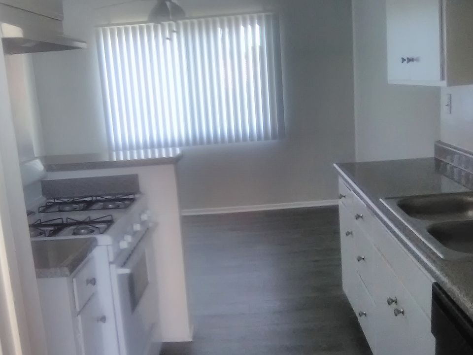 view through the kitchen to dining area from front door