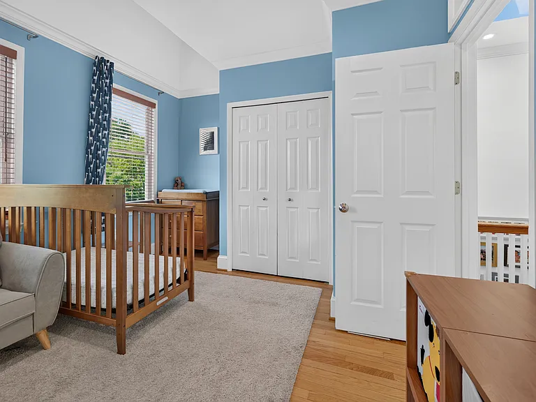 Bedroom #2 has 3 large windows opening to the front of the home.
