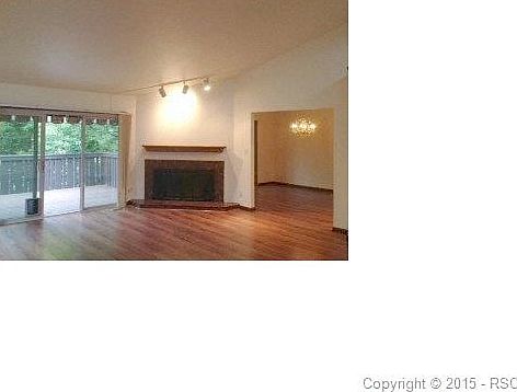 Fireplace in Great Room.  left is walk-out to deck and right is dining room