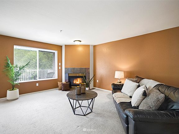 Spacious cozy living room with gas fireplace