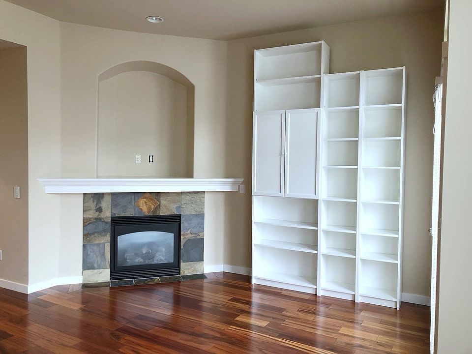 Fireplace and beautiful hardwood flooring. 