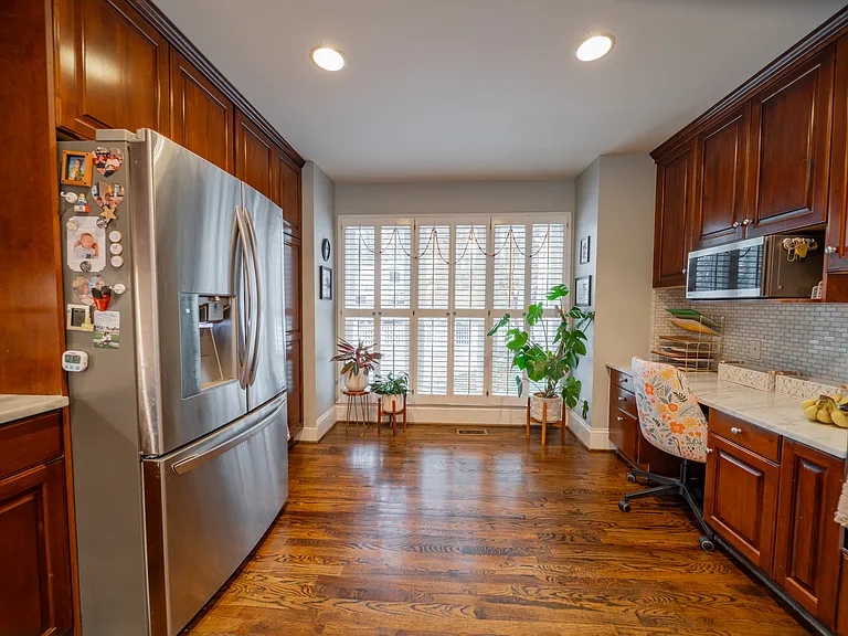 Fridge is included, but other furnishings have been removed.