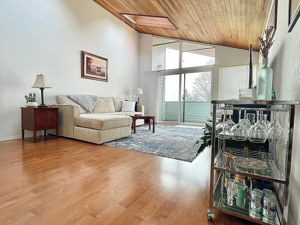 Open, light filled floor plan with gorgeous wood paneled, vaulted ceilings with skylights and large windows!