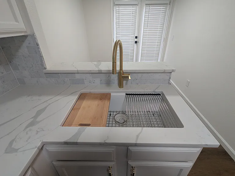 Work Kitchen Sink with accessories. Drying rack, cutting board, and strainer.