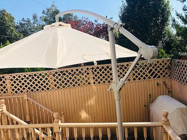 Rear deck and patio area w/ oversized umbrella and natural gas fed Webber grill
