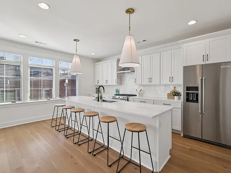 Kitchen with large center island, pendant lighting, and open-concept layout.