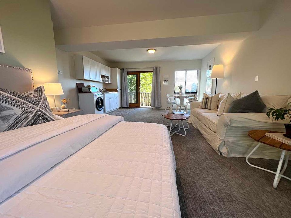 View of living area. Facing East towards your door and deck. Lots of morning light!