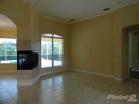 Formal sitting room with double sided gas fireplace