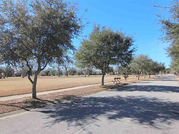 Large community park with covered pavilion with picnic tables just 4 houses down the street from property