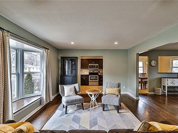 Tow living spaces provide the perfect entertaining home! Large bay window allows for light to pour through the space!