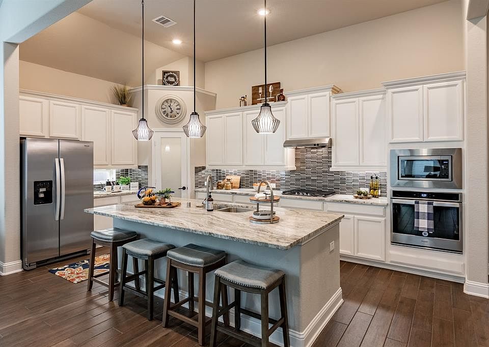 Beautiful wood looking tile floors continue throughout the kitchen and entire downstairs main living space.