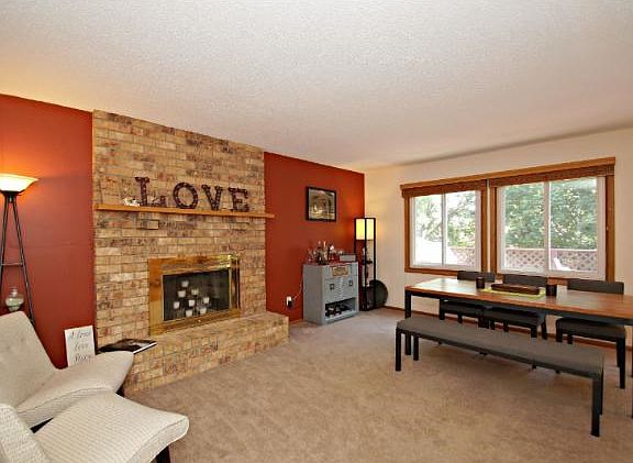 Nice open floor plan on this main level makes the house feel very open.  Living room comes complete with wood burning fireplace.