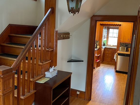Entry looking into the kitchen, bedrooms upstairs.