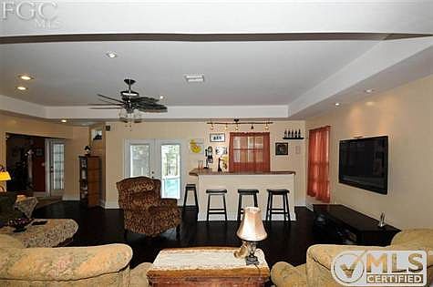 Large  Family Living Room Addition built in 2001  which includes a bar, 1/2 bath room, Sewing Room and Den