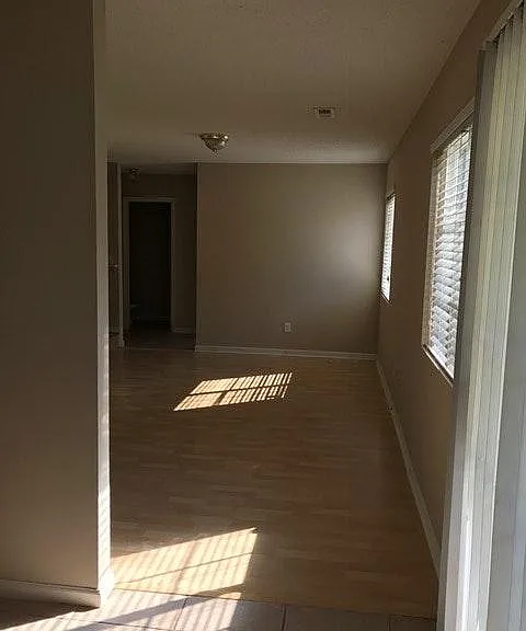 Unfurnished view of family room from kitchen