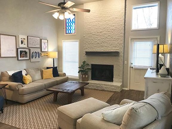 Living room with wood burning fire place.