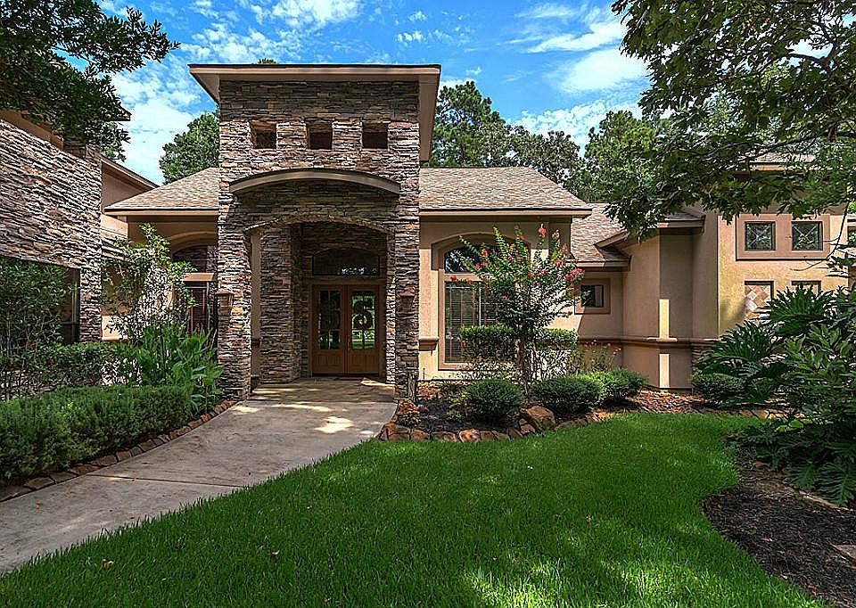 Beautiful custom stucco and stacked home on a quiet street in Benders Landing Estates. A huge privac