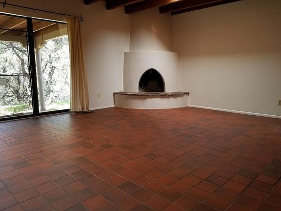 Family room with kiva fireplace and slider.