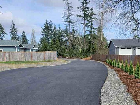 Tree lined driveway down a private driveway offers privacy and seclusion.