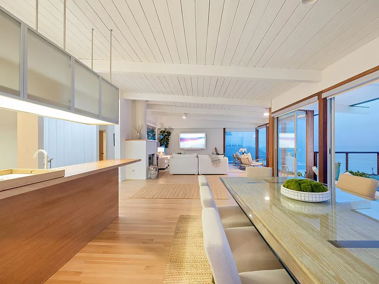 If the evening air becomes chilly, move inside to the expansive dining table next to the kitchen.
