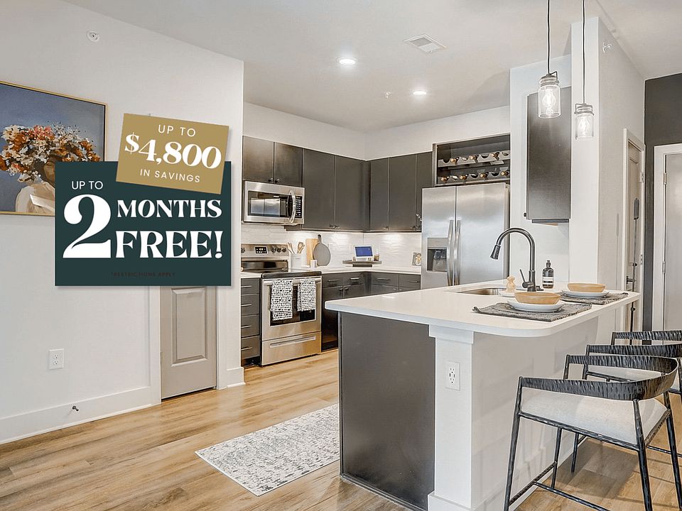 Kitchen with Quartz Countertop and Stainless Steel Appliances.