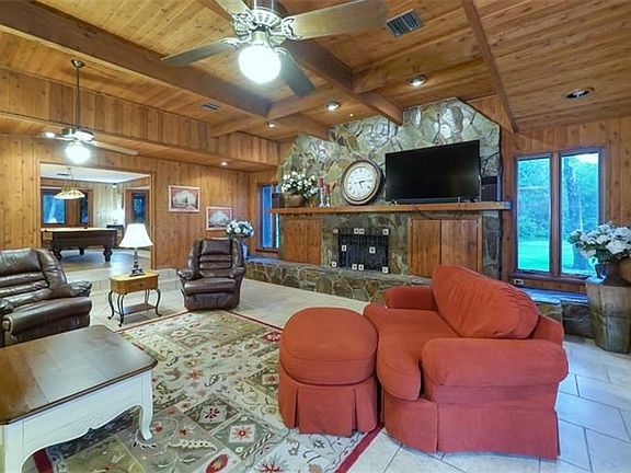 Spacious & warm great room with North Carolina stone and cedar wood.