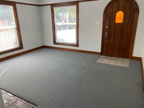 Living room and front entry door - looking west towards Van Ness Blvd.